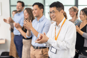 People standing and clapping