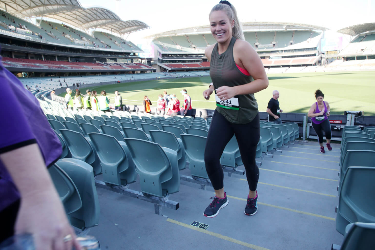 A stadium stomp participant smiling while taking on the event